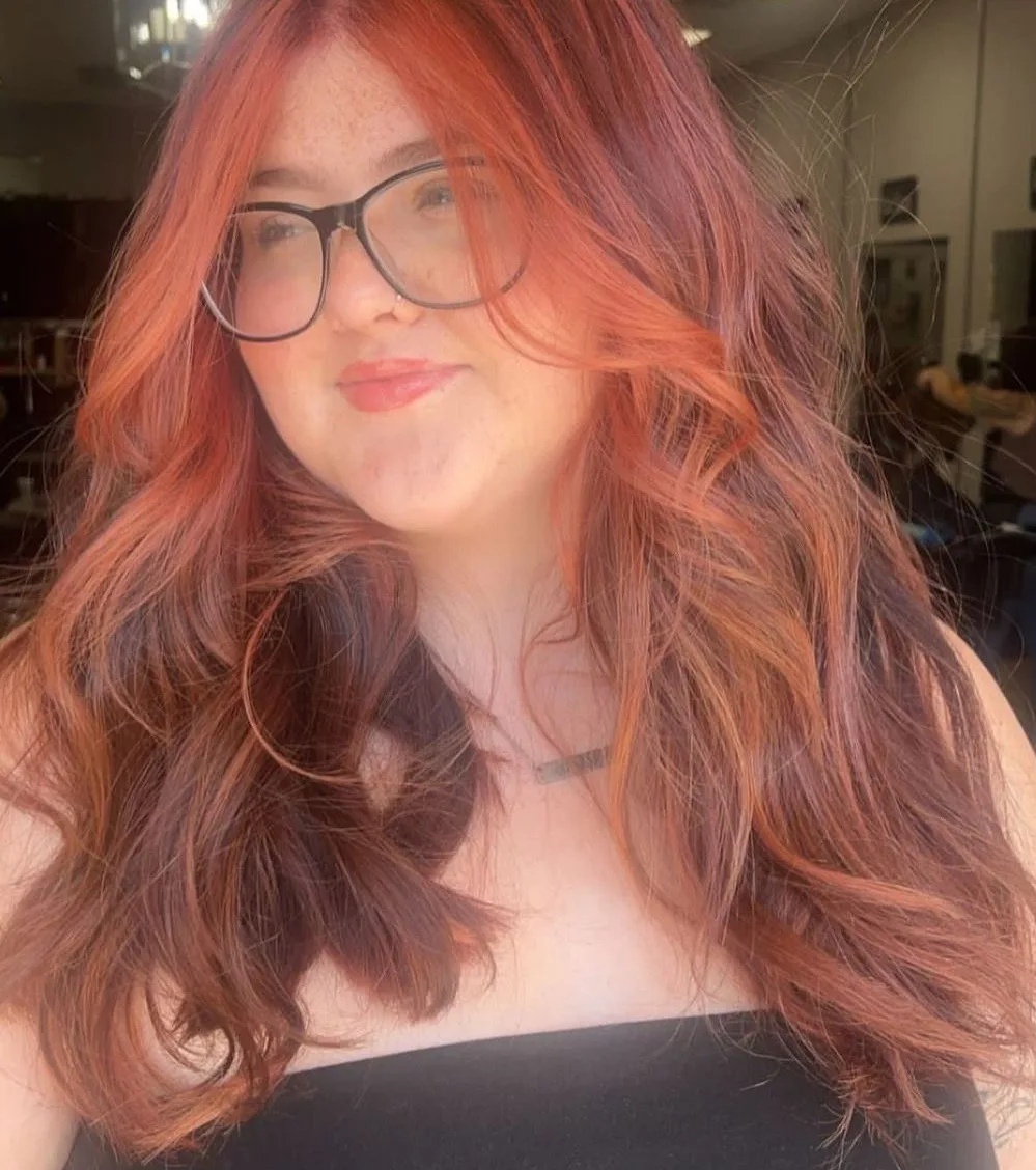 Dimensional red and copper color on long layered hair